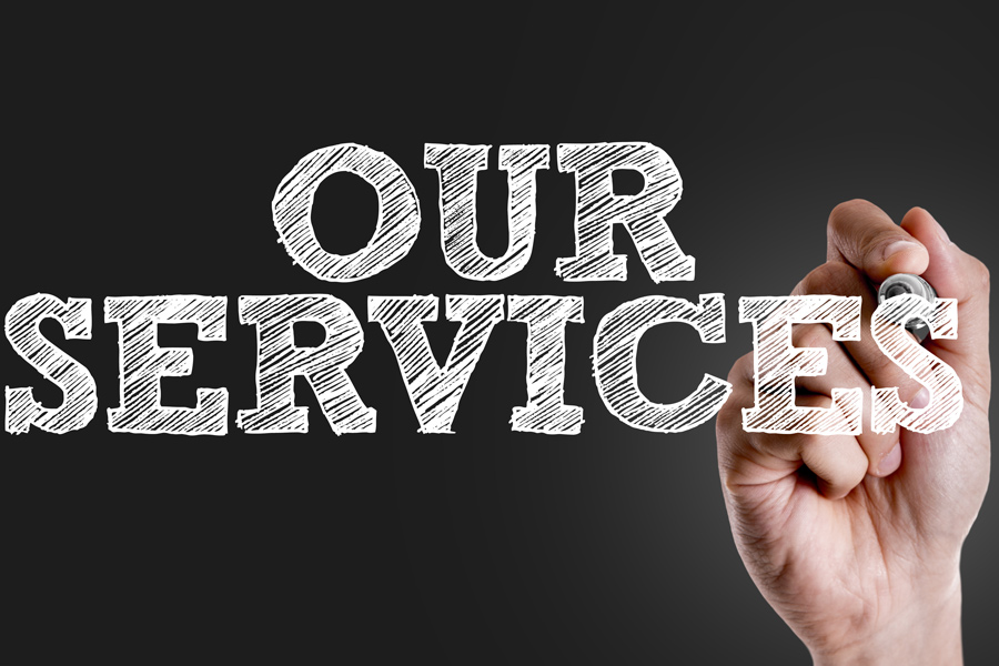 A hand writing "our services" in large text